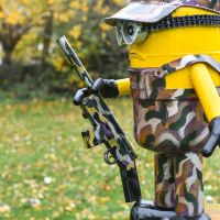 Recycled Metal "Ghillie Suit Soldier" Minion Sculpture in Sit Recycled Metal "Ghillie Suit Soldier" Minion Sculpture in Sit