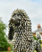 Close up of intricate face detail on recycled metal art sculpture