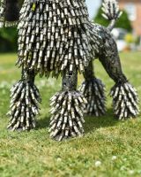 Close up of intricate detail on sparkplug detail on scrap metal poodle sculpture