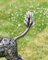 Close up of tail detail on recycled metal poodle sculpture
