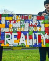 Recycled Oil drum wall art caution the media is not a reflection of reality close up centre Recycled Oil drum wall art caution the media is not a reflection of reality close up centre