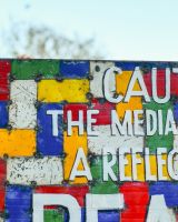 Recycled Oil drum wall art caution the media is not a reflection of reality close up left Recycled Oil drum wall art caution the media is not a reflection of reality close up left