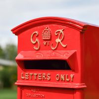 Close-Up of Red & Gold Motif on Freestanding Post box Close-Up of Red & Gold Motif on Freestanding Post box