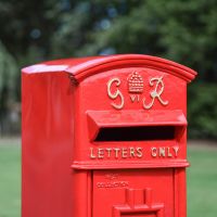 Close-Up of Red & Gold Motif on Freestanding Post box in Situ Close-Up of Red & Gold Motif on Freestanding Post box in Situ