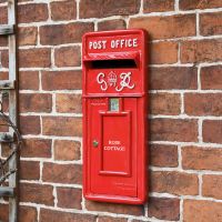 Personalised Red "King George" Rex Post Box Front Mounted on a Brick Wall