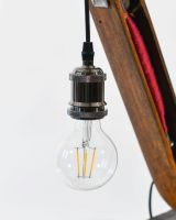 Close up of Red Loom Bobbin Table Lamp bulb