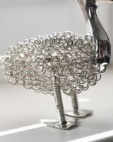 Close up of curly body detail on recycled metal art sculpture
