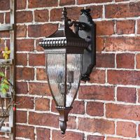 Renaissance Style Standard Hanging Bronze Wall Lantern in Situ on the Front of a House Renaissance Style Standard Hanging Bronze Wall Lantern in Situ on the Front of a House