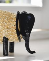 Close up of face detail on recycled metal art sculpture