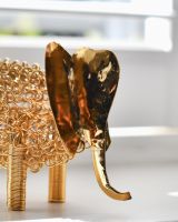 Close up of face detail on recycled metal art sculpture