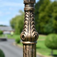 Ribbed Detailing on ornate gold lamp post column