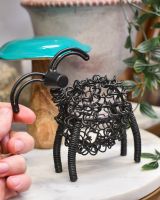 Scale of scrap metal art sculpture