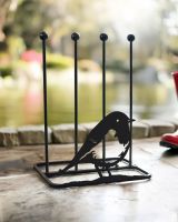 Boot rack with robin silhouette in a porch