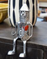 Sitting "Rusty" Tin Man Garden Ornaments Positioned on their own Sitting "Rusty" Tin Man Garden Ornaments Positioned on their own