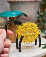 scale of scrap metal art sculpture