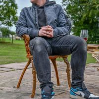 Male sat on Rustic Cast Iron Heart Scrolled Chair for scale Male sat on Rustic Cast Iron Heart Scrolled Chair for scale