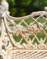 Close up of ornate rustic finish on garden bench