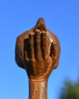 Close Up of Rustic Cast Iron Blowing a Kiss Garden Sculpture