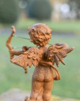 View of Detail on Rustic Cast Iron "Cupid"s Arrow" Garden Sculpture