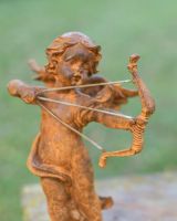 Rustic Cast Iron "Cupid"s Arrow" Garden Sculpture in Situ