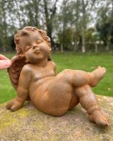 Scale image of sitting cherub outdoor statue