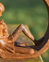 Close-Up of Rustic Cast Iron "Enclosed Care" Garden Sculpture