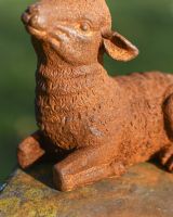 Close Up Of Rustic Cast Iron Lying Down Lamb Detailing