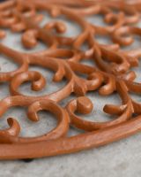 Close-Up of Delicate Twist Pattern on Rustic Cast Iron Door Mat