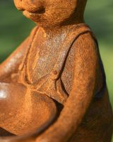 Close Up Of Rustic Cast Iron Rabbit Holding Bowl Sculpture & Bird Bath Dungarees Detailing Close Up Of Rustic Cast Iron Rabbit Holding Bowl Sculpture & Bird Bath Dungarees Detailing