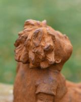 Close-Up of Rustic Cast Iron "Sunbathing Child" Garden Sculpture