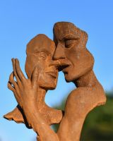 Close Up Of Cast Iron Rustic Embracing Couple Garden Sculpture