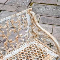 Close-up of the Aged Cream "Quatrefoil" Style of the Bench