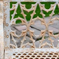 Close-up of the Aged Cream "Quatrefoil" Style of the Bench