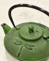 Close up of Black Handle and Embossed Dragonfly Pattern