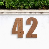 Rustic Individual House Numbers - Impact Font on garden wall