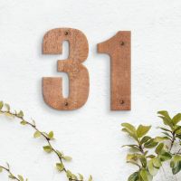 Rustic Individual House Numbers - Impact Font on white wall