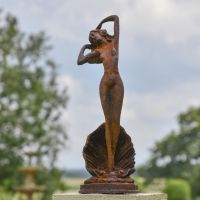 Lady Standing on Clam Sculpture in Situ in the Garden