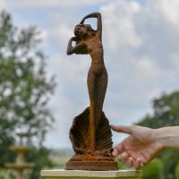 Lady Standing on Clam Sculpture to Scale