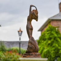View of the Back of the Lady Standing on Clam Sculpture
