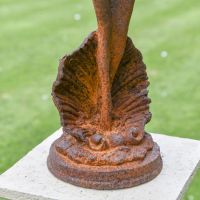 Close-up of the Base of the Lady Standing on Clam Sculpture