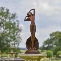 Lady Standing on Clam Sculpture in Situ