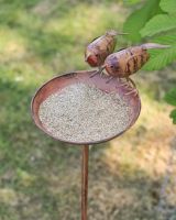 Close up of bowl detail on bird feeder