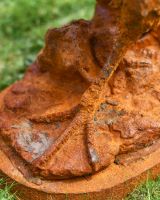 Close up of Rustic Rooster Cast Iron Sculpture base and foot detail Close up of Rustic Rooster Cast Iron Sculpture base and foot detail