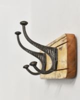 Side view of the Rustic Wood And Iron Coat Hooks in yellow