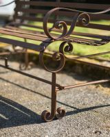 Close-Up of Ornate Pattern on Armrest for Two Seater Garden Bench