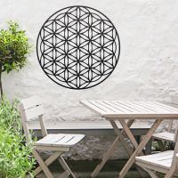 Geometry "Flower of Life" Steel Wall Art in Situ Outside Above a Wooden Table Set Geometry "Flower of Life" Steel Wall Art in Situ Outside Above a Wooden Table Set