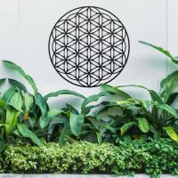 Geometry "Flower of Life" Steel Wall Art Above Bushes in the Garden Geometry "Flower of Life" Steel Wall Art Above Bushes in the Garden