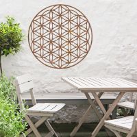 Geometry "Flower of Life" Steel Wall Art in Situ Outside Above a Wooden Table Set