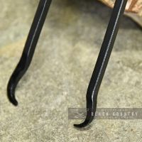 Natural Iron Twist Fireplace Tongs Close Up Natural Iron Twist Fireplace Tongs Close Up