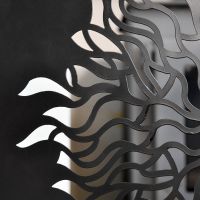 Close up of fire screen with aurora motif Close up of fire screen with aurora motif